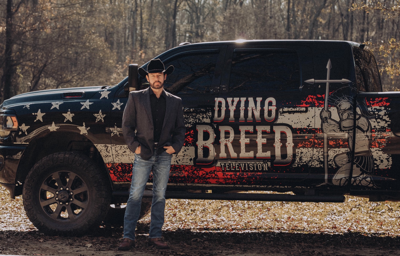 Shawn Chatham beside the Dying Breed Television truck
