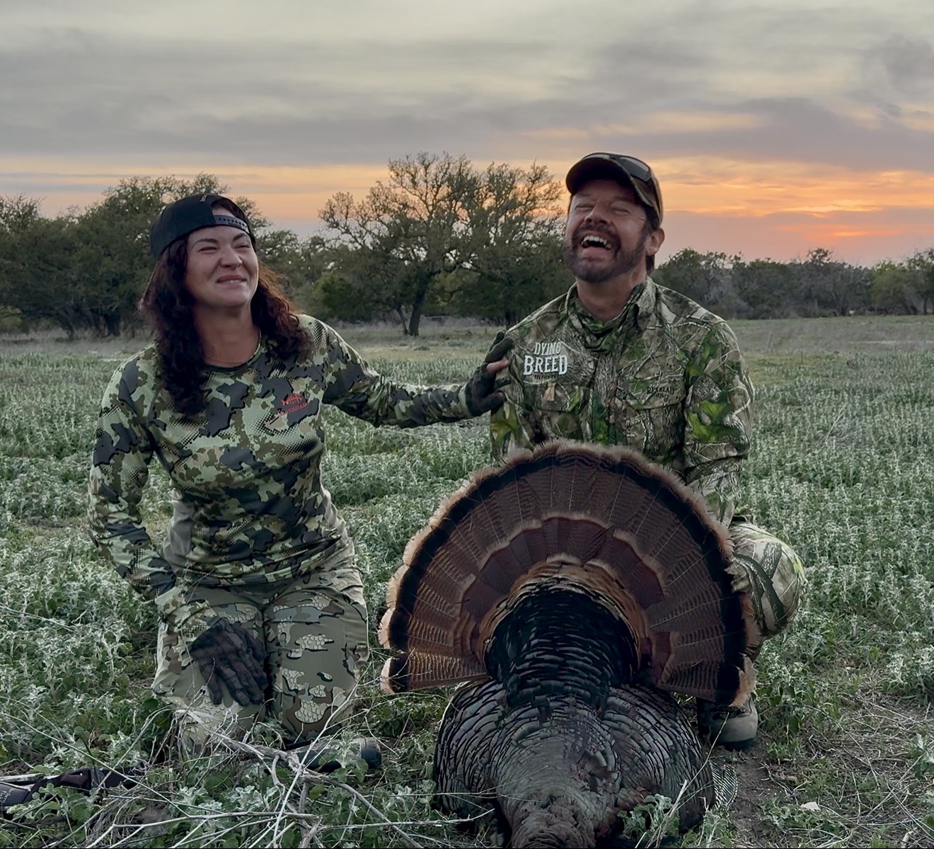 A hunter and a turkey at sunset