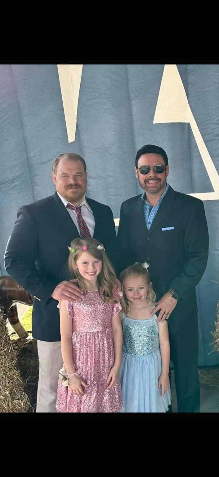 A family gathered together at a formal event