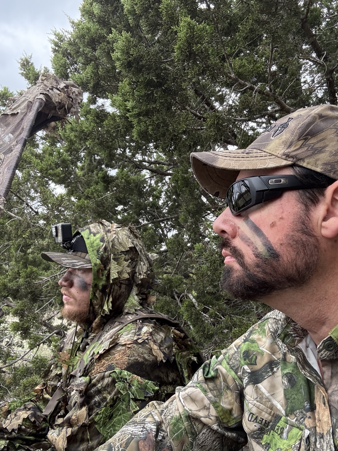 Two hunters sharing a quiet moment in the field
